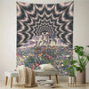 A wall tapestry featuring a psychedelic eye radiating light over a mountain landscape covered in colorful flowers.