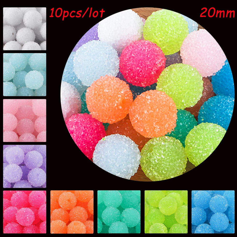 A collection of colorful textured resin beads in various shades and sizes, including pink, green, orange, blue, and purple.