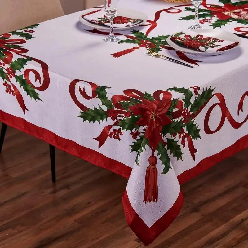 White rectangle tablecloth with a red and green poinsettia pattern and ribbon accents.