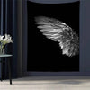 Black tapestry featuring a close-up, textured white angel wing against a dark background.