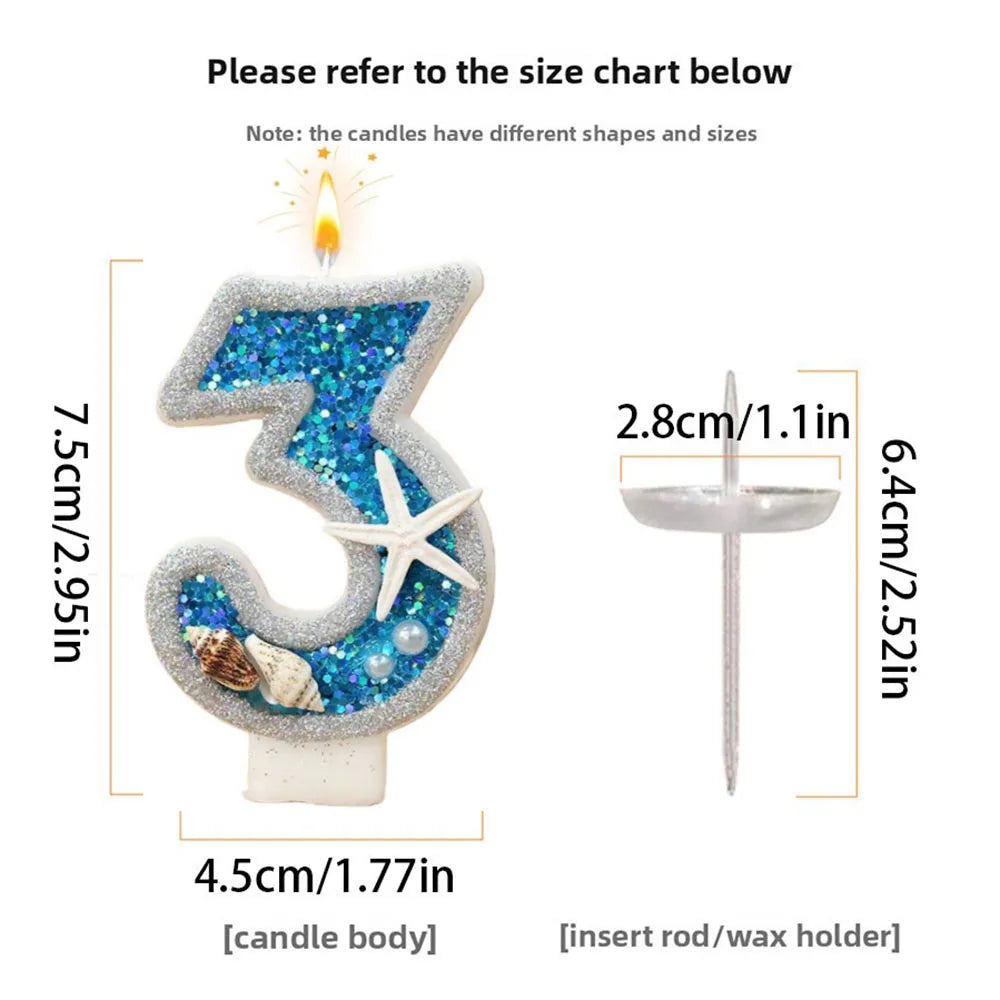 A large number 3 candle made of blue glitter wax with a starfish design and an insert rod holder.