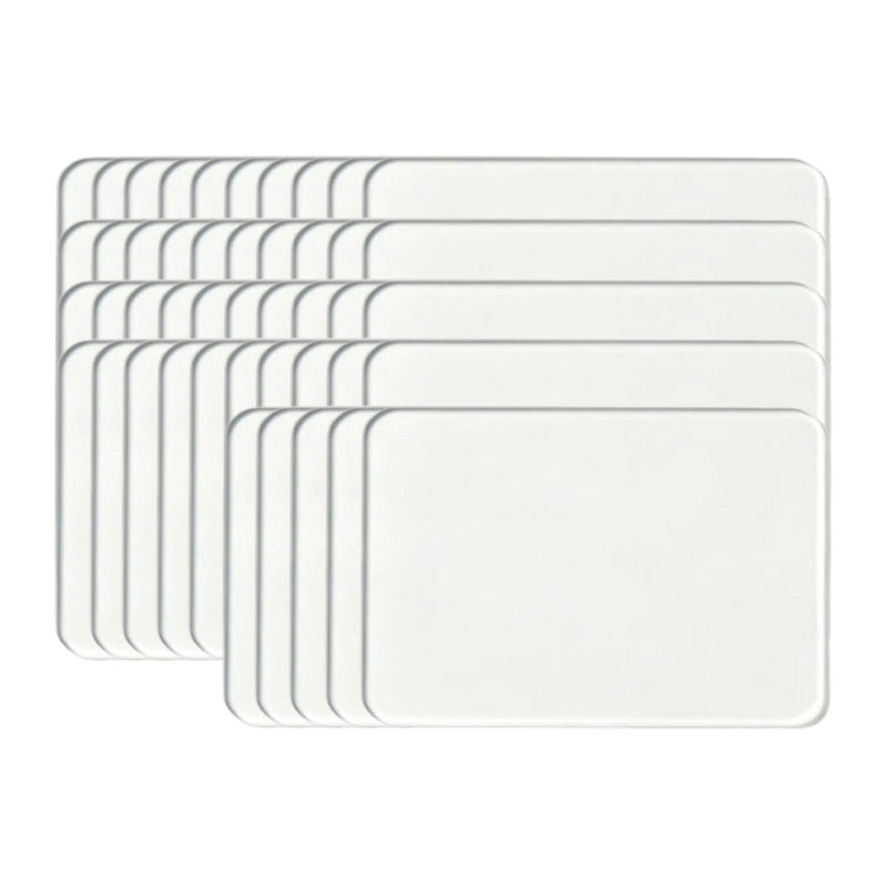 A stack of clear acrylic fridge magnets with flexible magnetic backing.