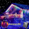 Outdoor house decorated with waterproof IP65 LED icicle string lights illuminating the facade and porch.