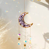 Handcrafted moon crystal suncatcher featuring a purple crescent pendant with dangling prism beads.