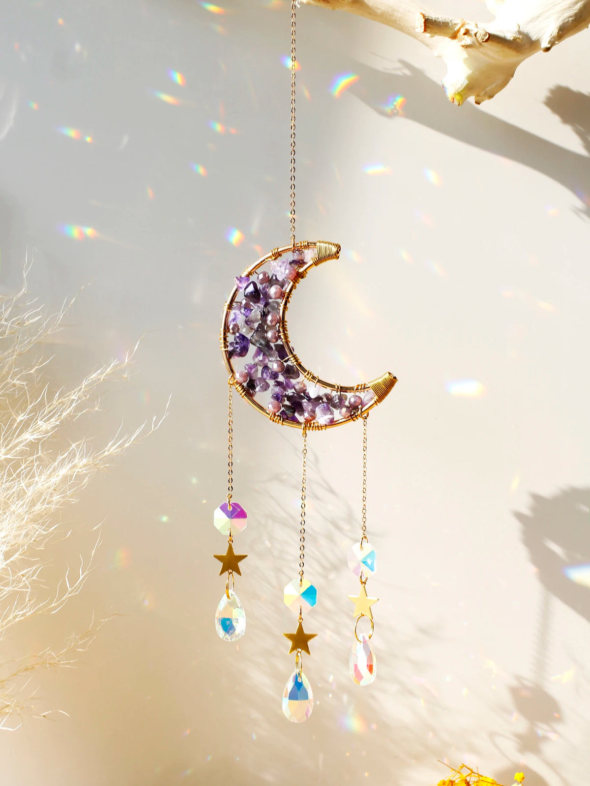 Handcrafted moon crystal suncatcher featuring a purple crescent pendant with dangling prism beads.