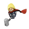 A building block figure of a blonde, fierce-looking character with a red cape and a patterned mask.