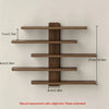 A set of four wooden floating wall shelves mounted on a light-colored wall.