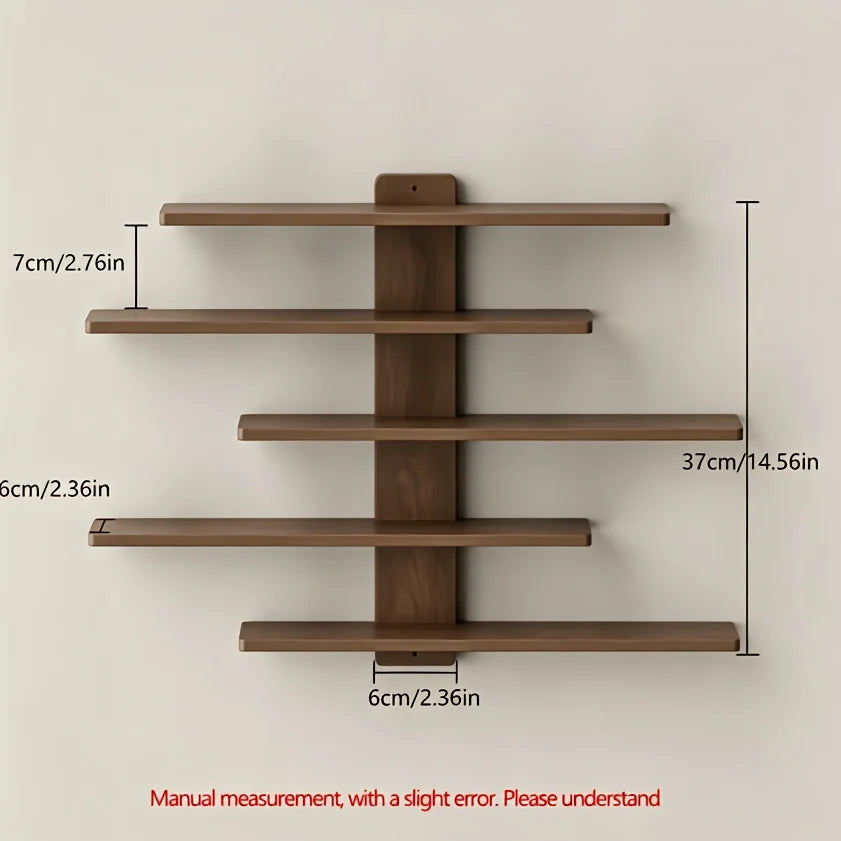 A set of four wooden floating wall shelves mounted on a light-colored wall.
