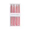 A set of four pink tapered candles with a dripping blood effect inside a white box.