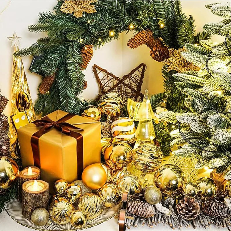 A festive display featuring gold and silver baubles, pine branches, and a wrapped gift decorated for Christmas holiday decor.