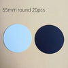Two round magnets, one light blue and one dark blue, are displayed against a beige background.