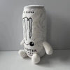 A white soft plush toy shaped like an energy drink can with a dripping liquid design.