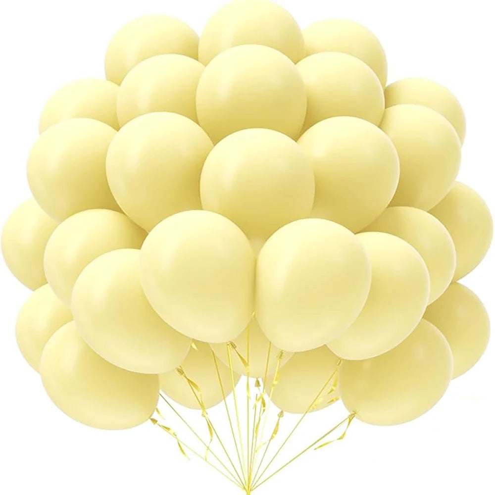 A bunch of pale yellow latex balloons tied together for party decorations