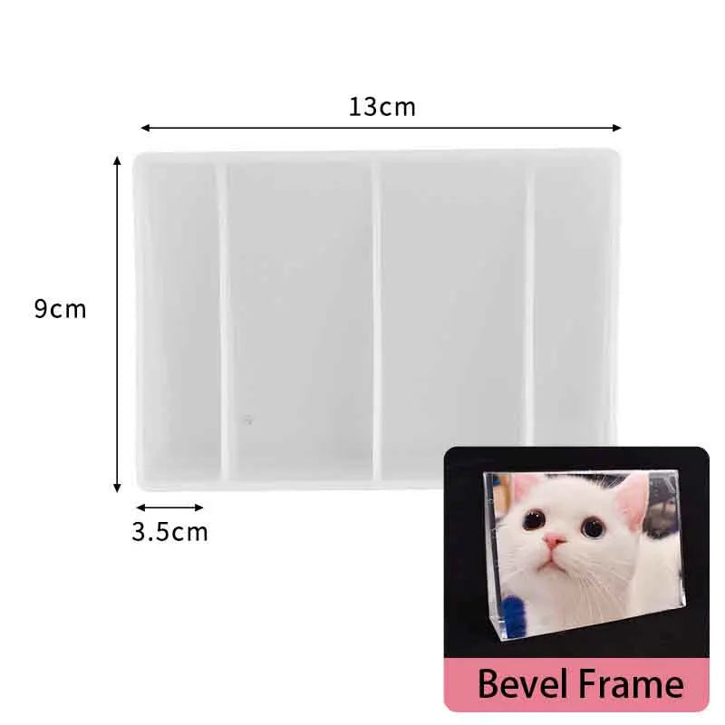 White bevel frame with a rectangular insert, measuring 13cm by 9cm.