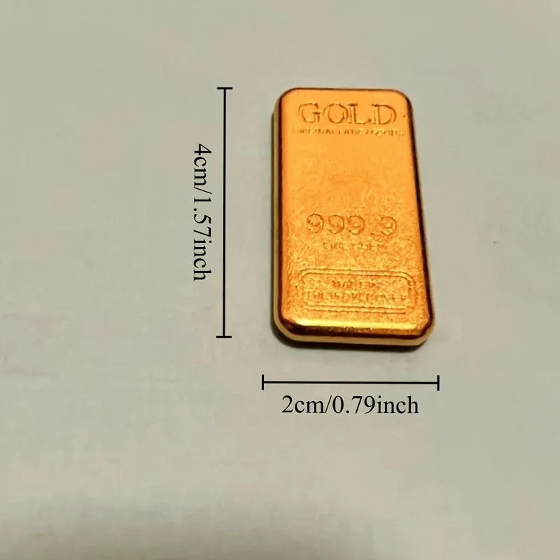 A rectangular gold-colored ingot with the marking 999.9 purity and a gold inscription.