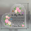 A clear heart-shaped acrylic keepsake plaque engraved with a floral design and the message I love you to my mum