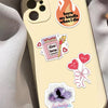 A phone case featuring romantic reading stickers including a burn candle graphic and a bat silhouette