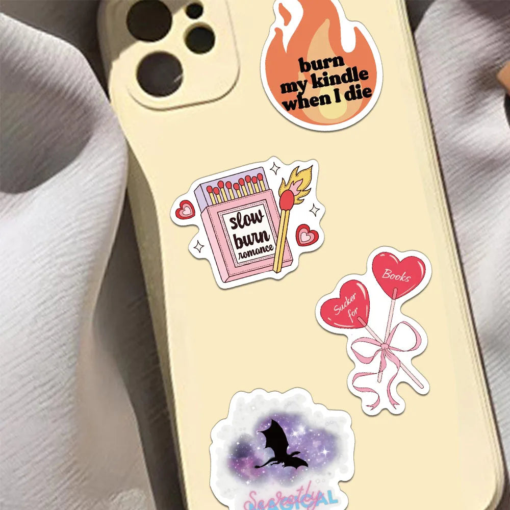 A phone case featuring romantic reading stickers including a burn candle graphic and a bat silhouette