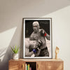A framed black and white photograph of Charles Oliveira in a martial arts stance.