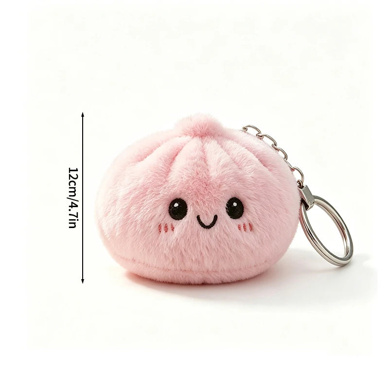 Pink fluffy butter dumpling squishy keychain charm with a smiling face