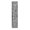 Vertical rustic metal sign with the word WELCOME carved into it surrounded by laurel leaves