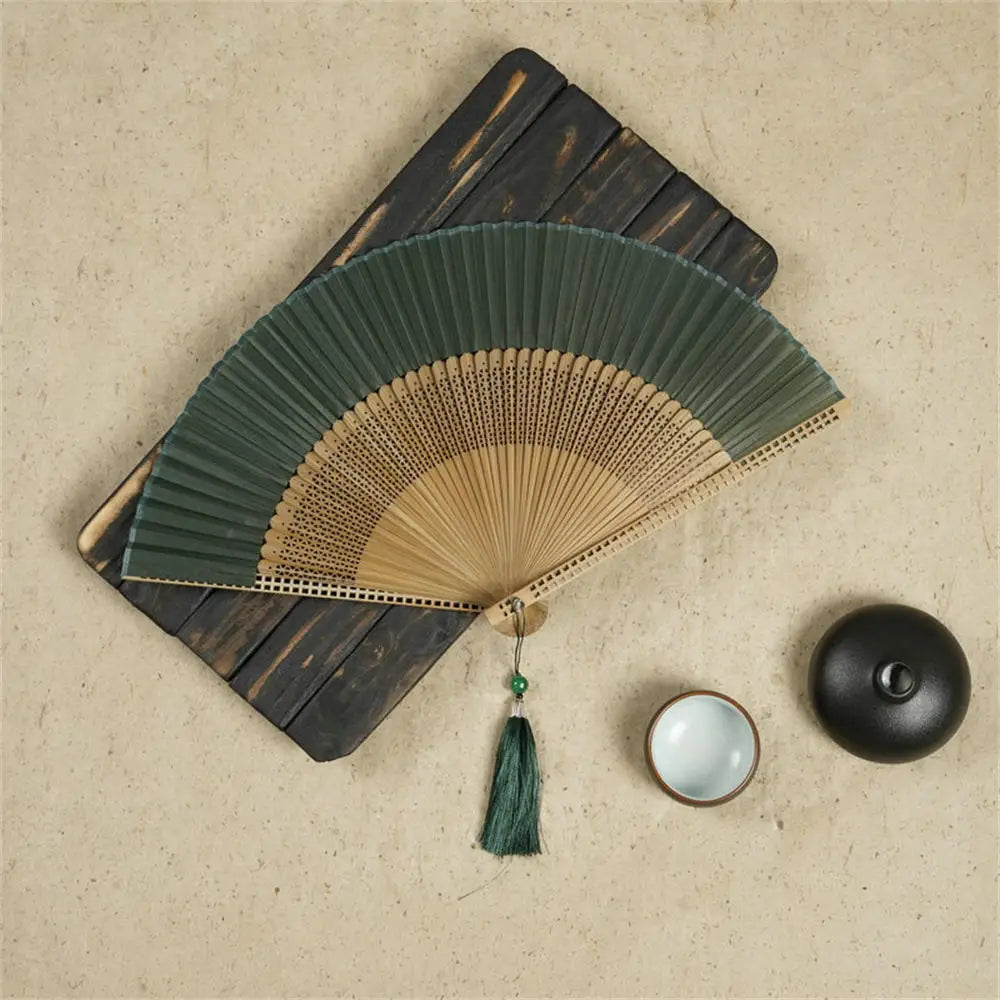 Traditional Bamboo Folding Fan with Solid Color Design