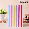 A vertical pack of six colored PVC photo corner protectors in striped designs for scrapbooking and albums.