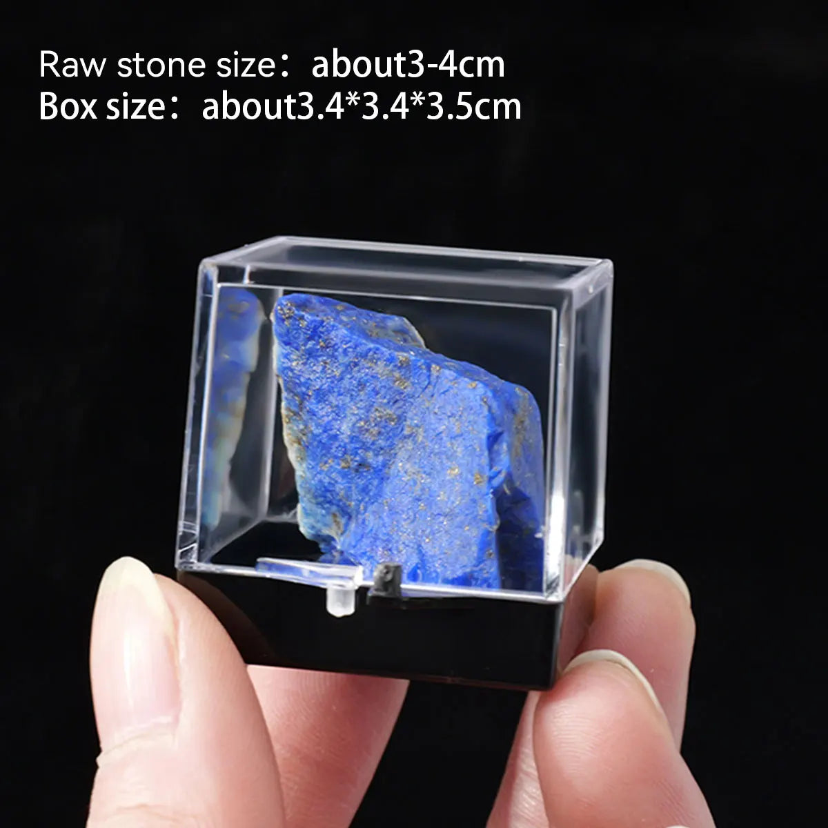 A clear box contains a rough, deep blue natural stone specimen.