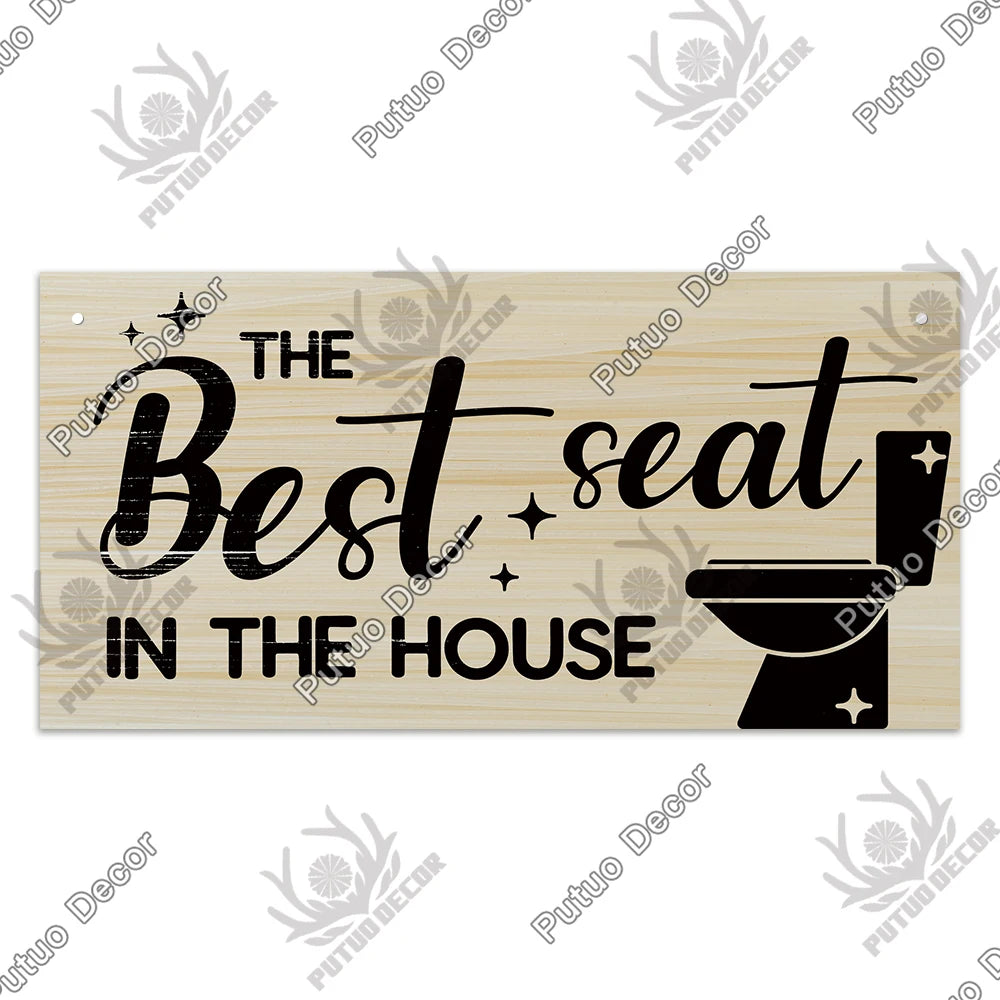 A rustic wooden sign with black text that reads The Best seat in the house.