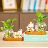 Mini resin desk ornament featuring a green ivy plant and a white lucky cat in a clear glass vase.