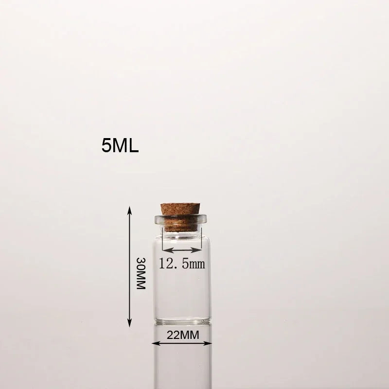 A clear glass bottle with a cork stopper and measurement lines indicating 5ML volume and dimensions.