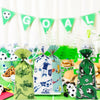 A set of soccer party supplies including a banner and green gift bags with soccer themes.