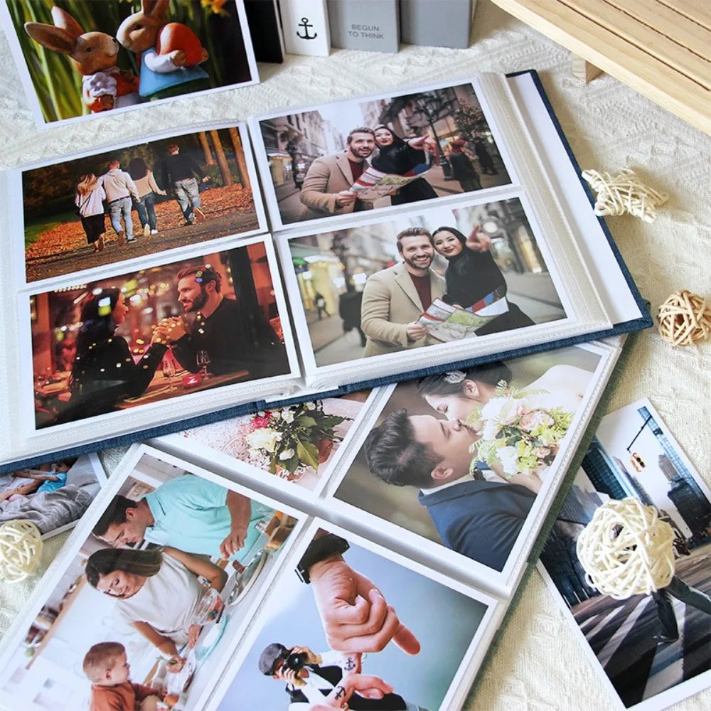 A collection of glossy photos displayed in a linen cover photo album with 200 pockets.