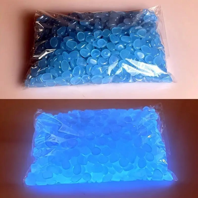 A clear plastic bag filled with bright blue glow-in-the-dark luminous pebbles.