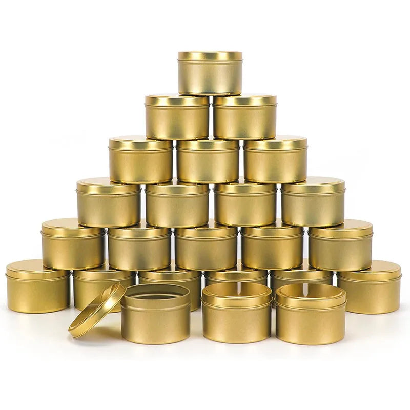 A pyramid stack of brass or gold metal candle tins with lids.