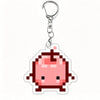 A pink pixel art charm of a pig character attached to a silver keychain ring.