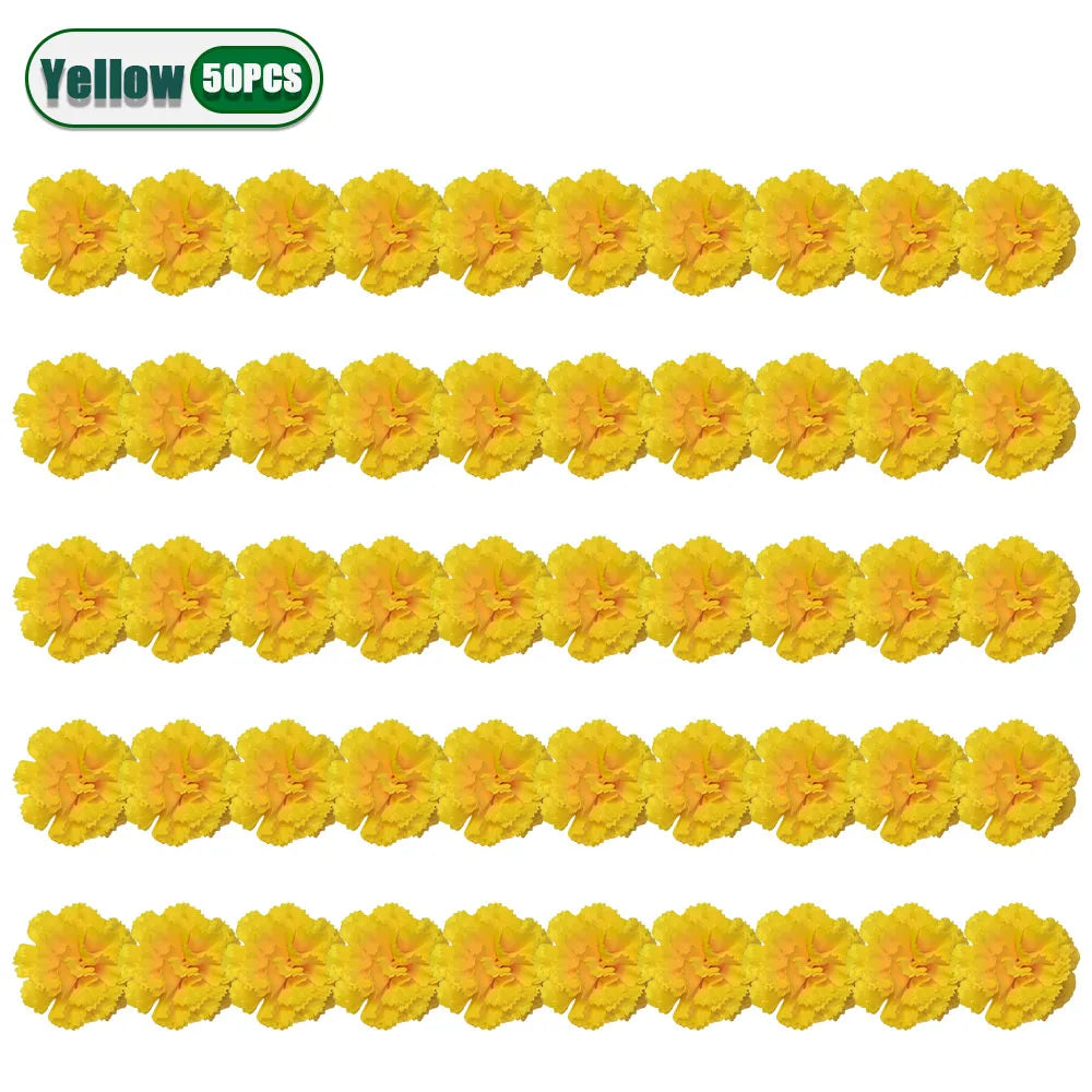 A string of yellow artificial carnation and marigold flower heads for festive décor.