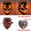 A pair of glow-in-the-dark LED purge masks displayed in close-up and full view, showing facial designs and battery informatio