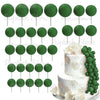 A set of green foam cake toppers on sticks, including various circular shapes.