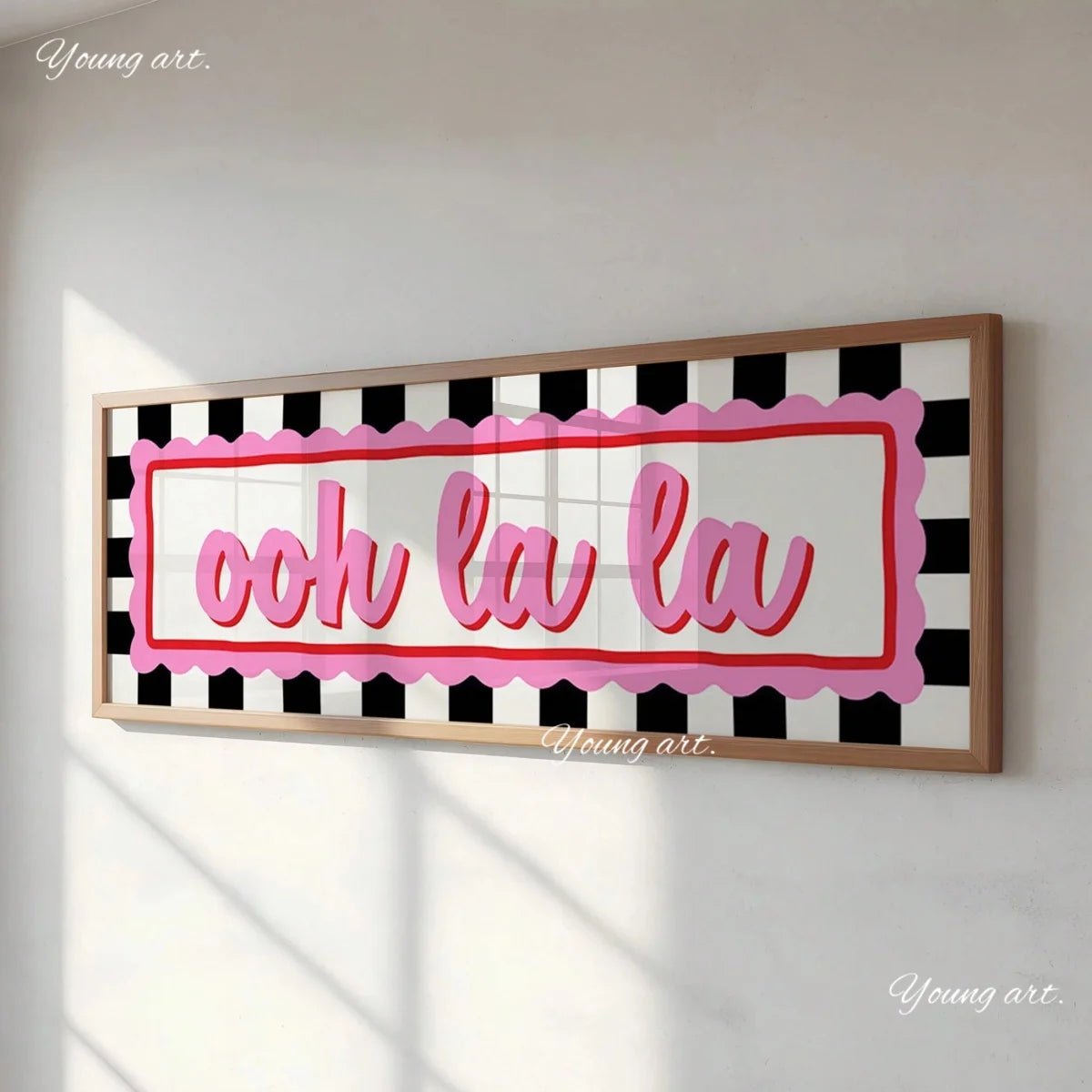 A framed canvas print featuring the pink text ooh la la on a black and white checkered background.