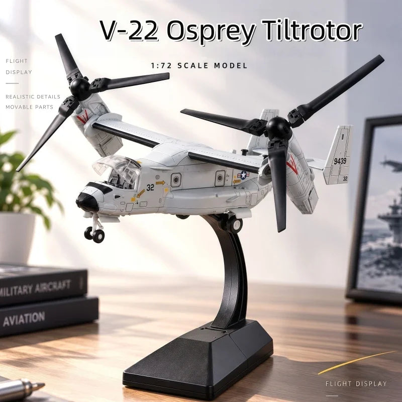 A 1:72 scale model of a V-22 Osprey tiltrotor aircraft displayed on a stand.