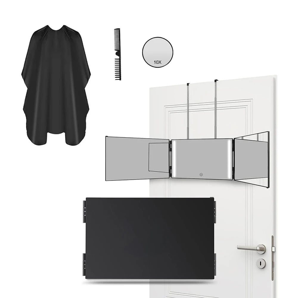 A black portable trifold vanity mirror with an adjustable hook shown next to a garment and a door.