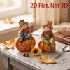A set of wooden autumn scarecrow decorations featuring carved figures and pumpkins on a rustic wooden table.
