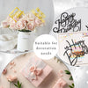 Gold acrylic cake toppers and pink roses used for birthday decoration
