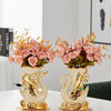 Gold ceramic swan vase with pink and orange flowers for tabletop decor