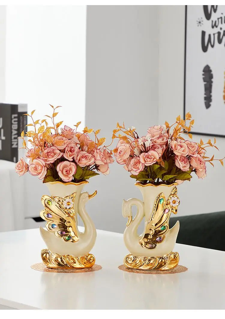 Gold ceramic swan vase with pink and orange flowers for tabletop decor