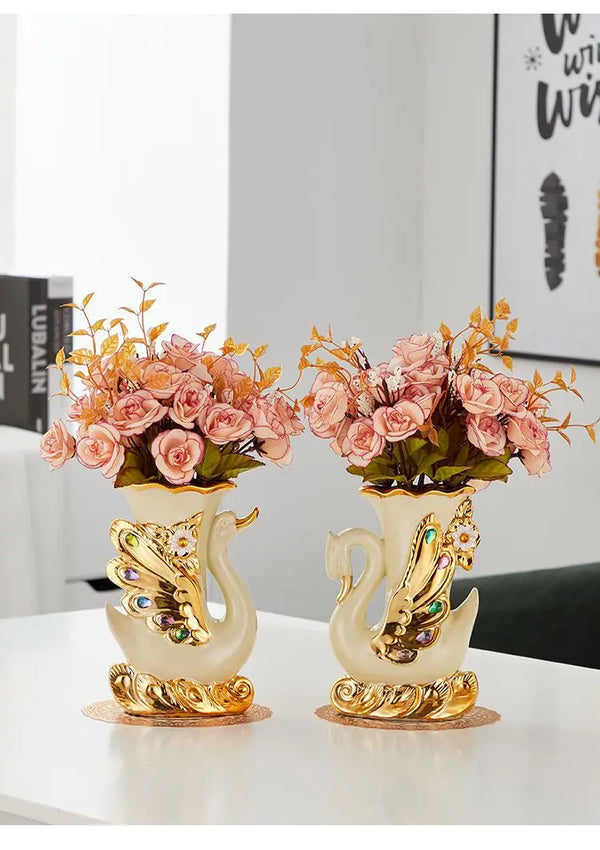 Gold ceramic swan vase with pink and orange flowers for tabletop decor
