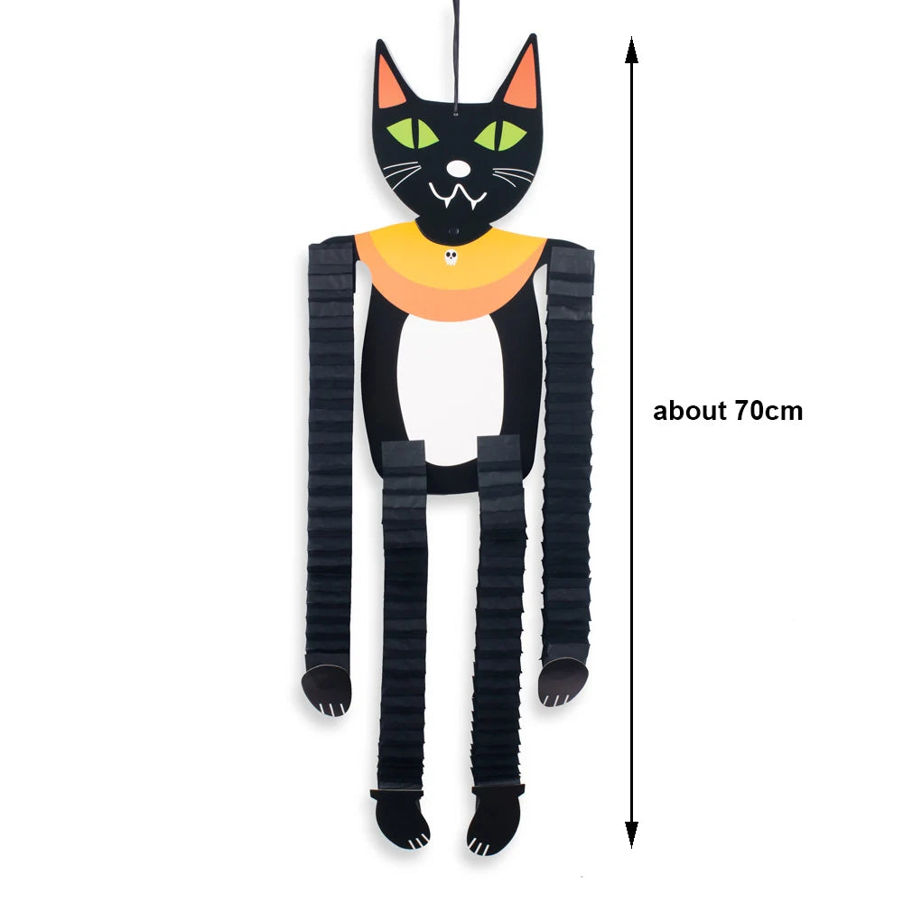 Black cat hanging ornament with yellow collar and black body, shown against a white background.
