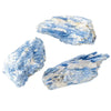 A cluster of light blue natural kyanite crystal stones showing striated texture.