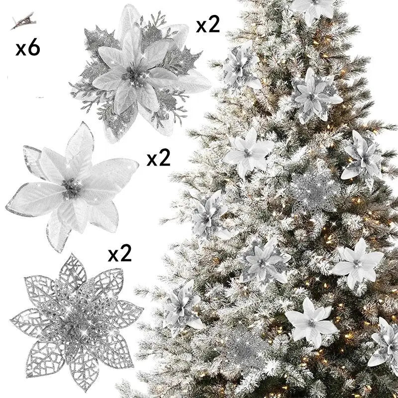 A set of six glittered artificial white Christmas flowers with clips displayed next to a decorated evergreen tree.